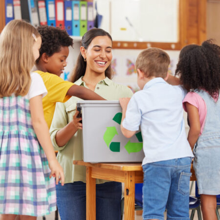 Theyre excited to learn. Shot of a young woman teaching  preschool children about recycling